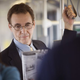 Image for article titled Guy In Suit Handling Newspaper Like A Pro
